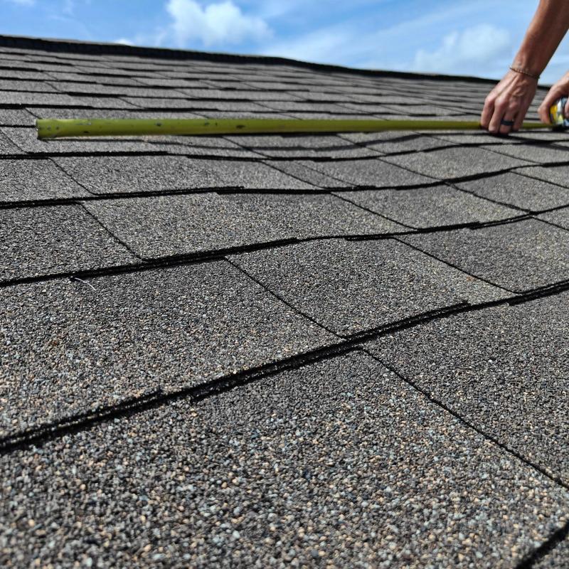Asphalt shingle roof valley measuring for nail placement