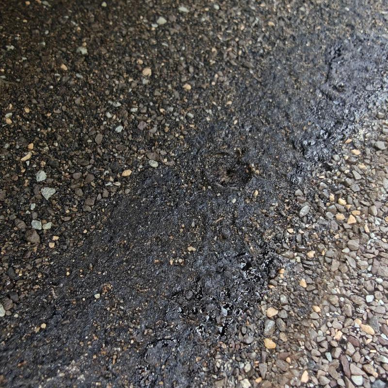 Asphalt shingle roof with nail hole damage near valley