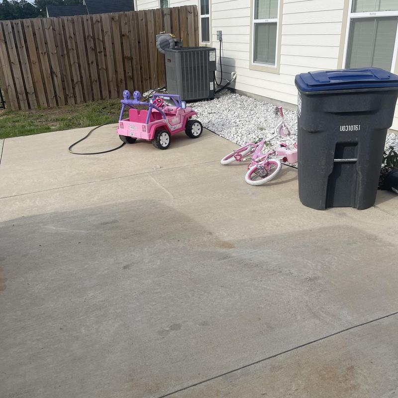 Residential HVAC outdoor condenser unit on concrete pad