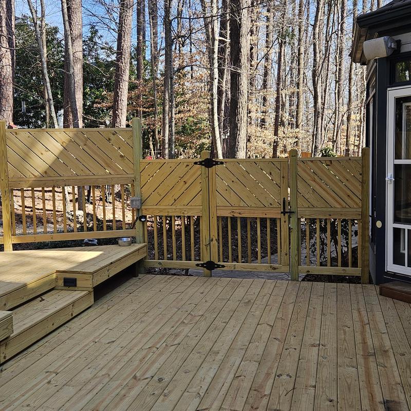 Wooden deck gate and fencing installation in backyard Wooden deck gate and fencing installation in backyard