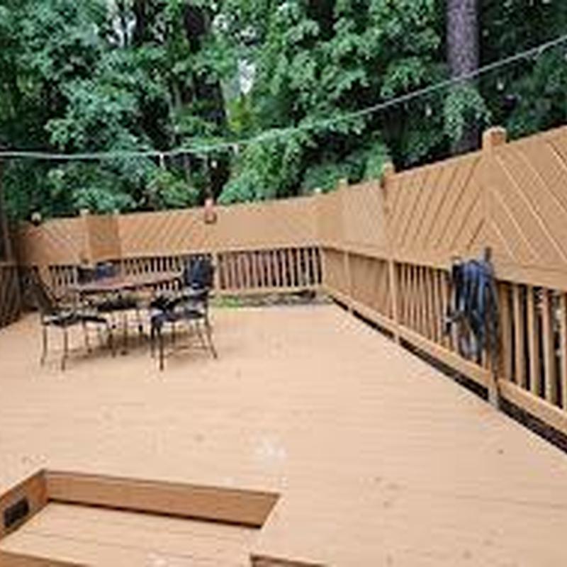 Wooden deck with privacy fence and patio furniture Wooden deck with privacy fence and patio furniture