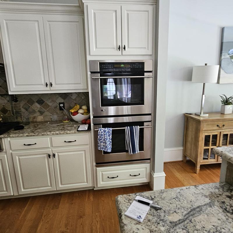 Double wall oven installation in white kitchen cabinetry Double wall oven installation in white kitchen cabinetry