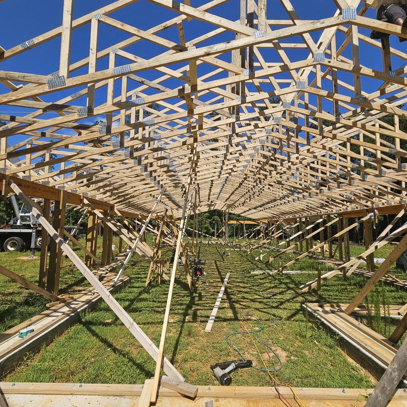 Wooden roof trusses framing under construction Wooden roof trusses framing under construction