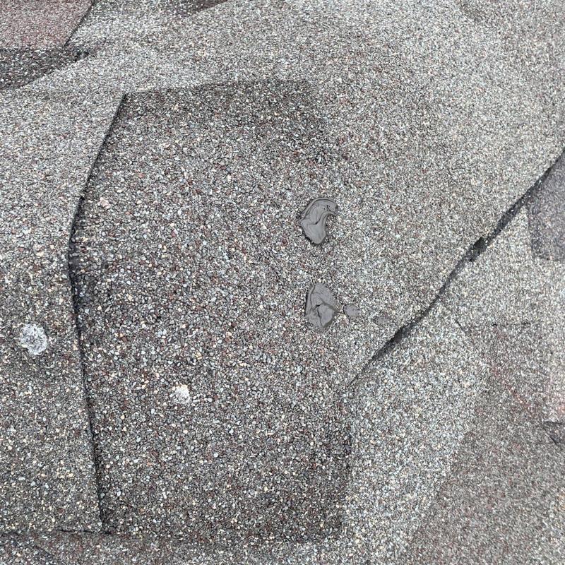 Asphalt roof shingles with sealed nail fasteners