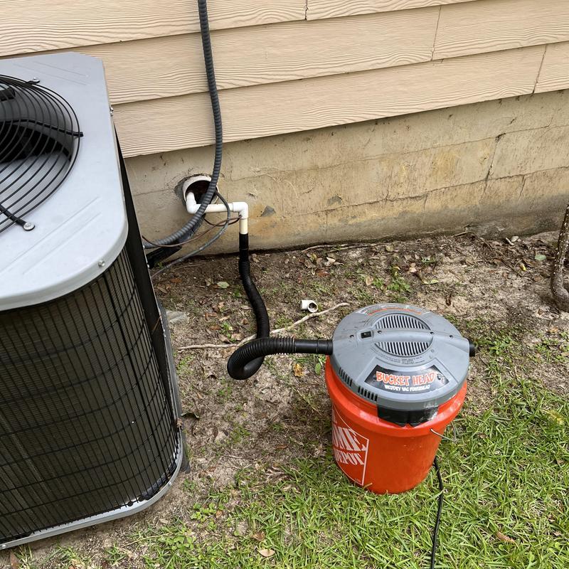 Drain line connected to HVAC system with vacuum bucket Drain line connected to HVAC system with vacuum bucket