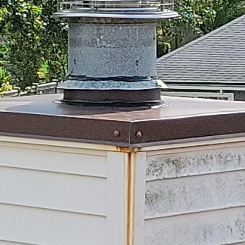 Aluminum chimney chase cover with rust stains Aluminum chimney chase cover with rust stains