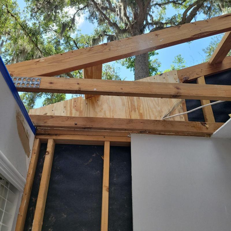 Wooden roof truss structure with plywood sheathing installation Wooden roof truss structure with plywood sheathing installation