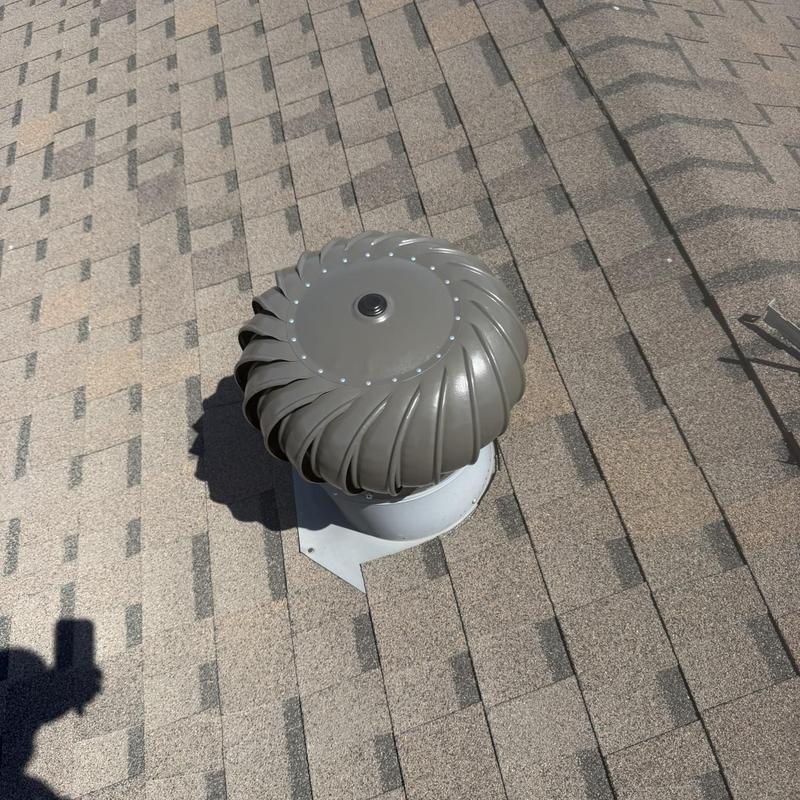 Whirlybird turbine vent on asphalt shingle roof