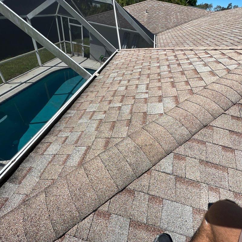 Shingle roof inspection over screened pool area Shingle roof inspection over screened pool area