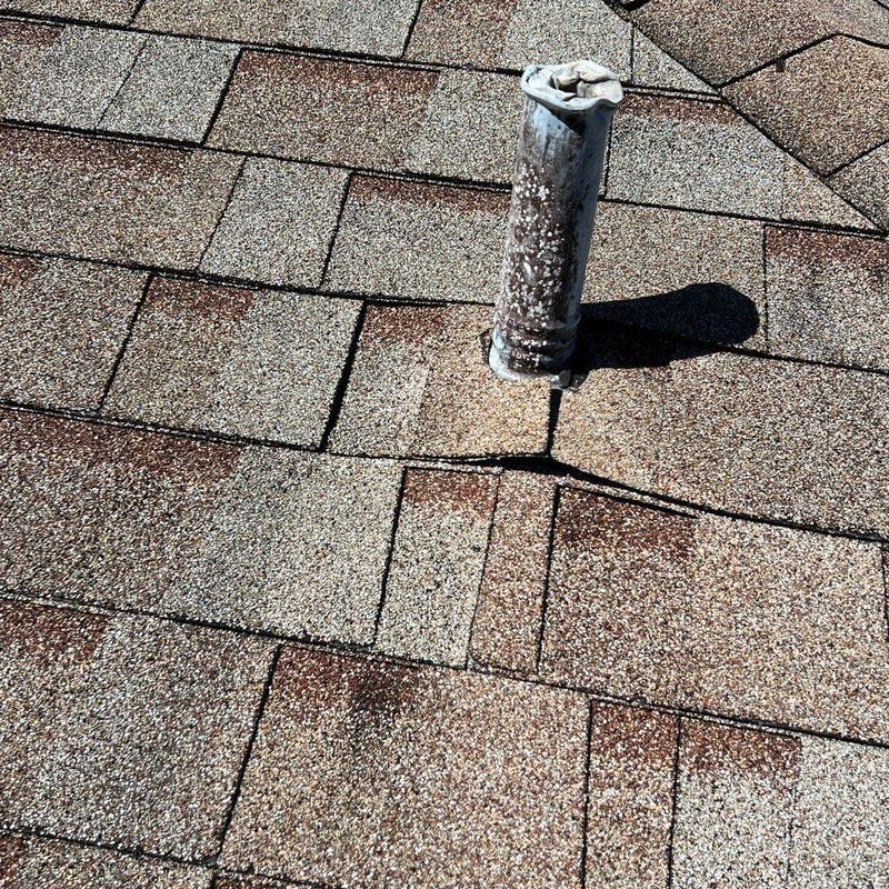 Shingle roof with cracked flashing pipe seal Shingle roof with cracked flashing pipe seal