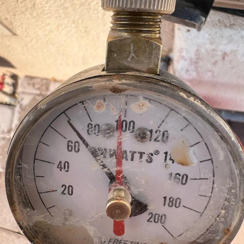 Pressure regulator valve gauge showing 68 PSI in Queen Creek