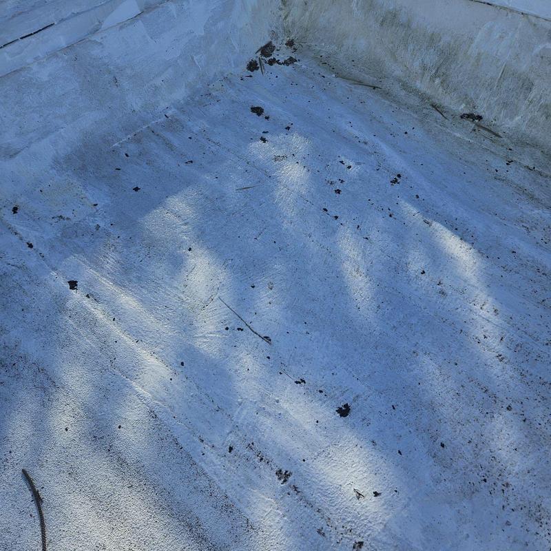 Flat roof membrane with active leaks and poor pitch