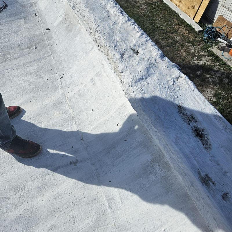 Flat roof membrane with standing water and damage