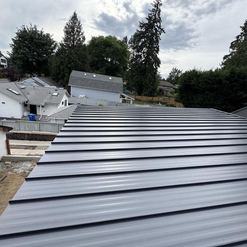 Metal roofing panels installed on residential roof