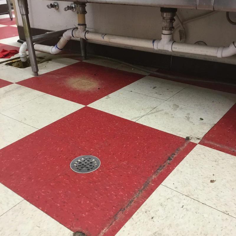 Kitchen floor sink drain under commercial sink pipes Kitchen floor sink drain under commercial sink pipes