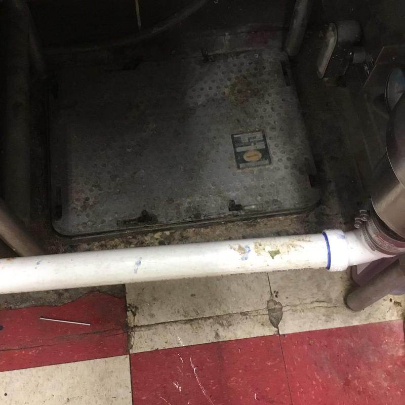 Grease interceptor and PVC pipe drain line in kitchen Grease interceptor and PVC pipe drain line in kitchen