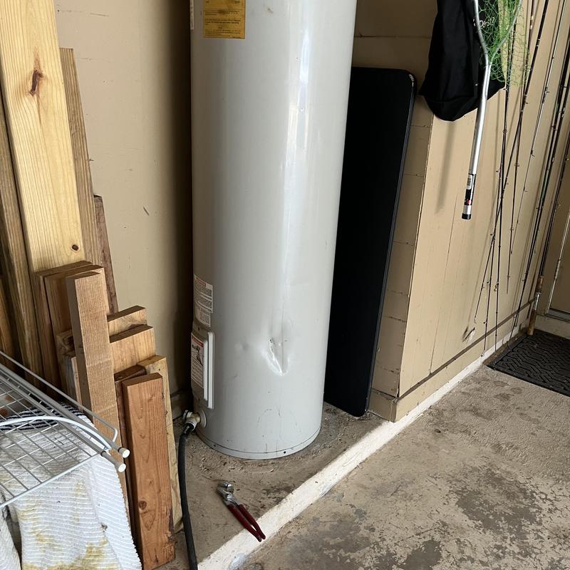 Water heater tank with dent and inspection tools Water heater tank with dent and inspection tools