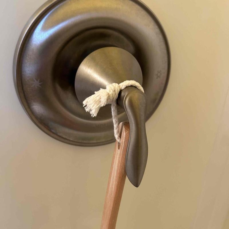Shower valve lever with towel tied on rope loop
