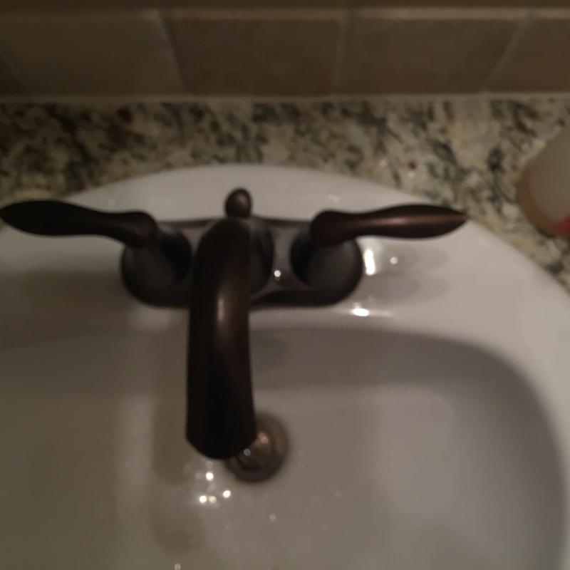 Oil rubbed bronze Moen Eva lavatory faucet on sink Oil rubbed bronze Moen Eva lavatory faucet on sink