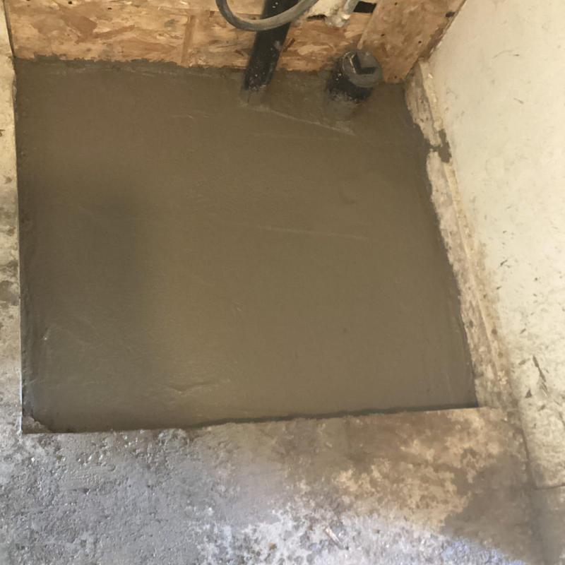 Concrete floor patch over plumbing access hole Concrete floor patch over plumbing access hole