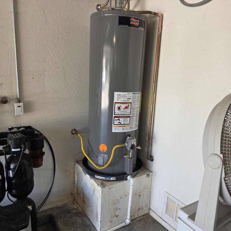Natural gas water heater with drain pan and supply lines Natural gas water heater with drain pan and supply lines