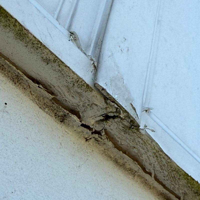 Metal roof edge with rust and corrosion damage