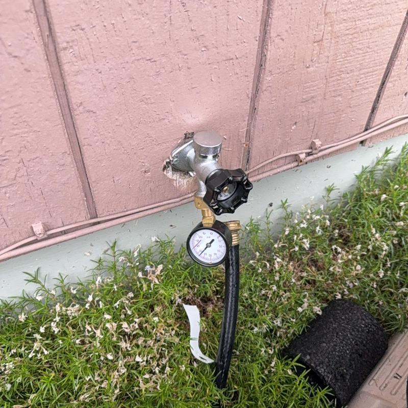 Frost free hose bib with pressure gauge outside wall