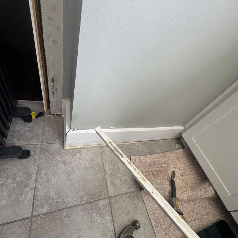 Baseboard trim removal and tile floor transition repair