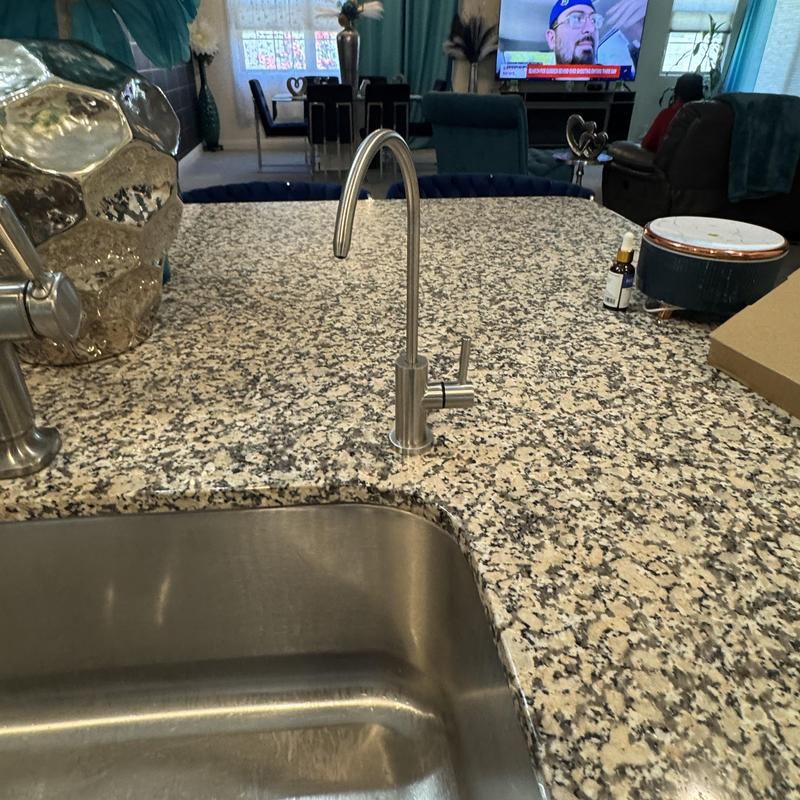 Nickel RO faucet on granite kitchen countertop