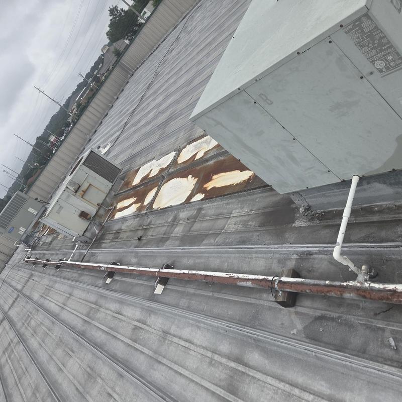 Trapazoidal standing seam metal roof with HVAC units Trapazoidal standing seam metal roof with HVAC units