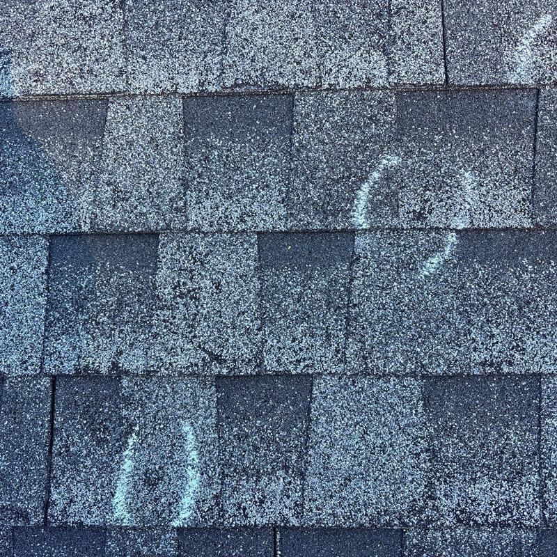 Roof shingles with hail damage markings
