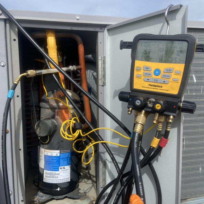 Rooftop HVAC unit refrigerant gauges and compressor Rooftop HVAC unit refrigerant gauges and compressor