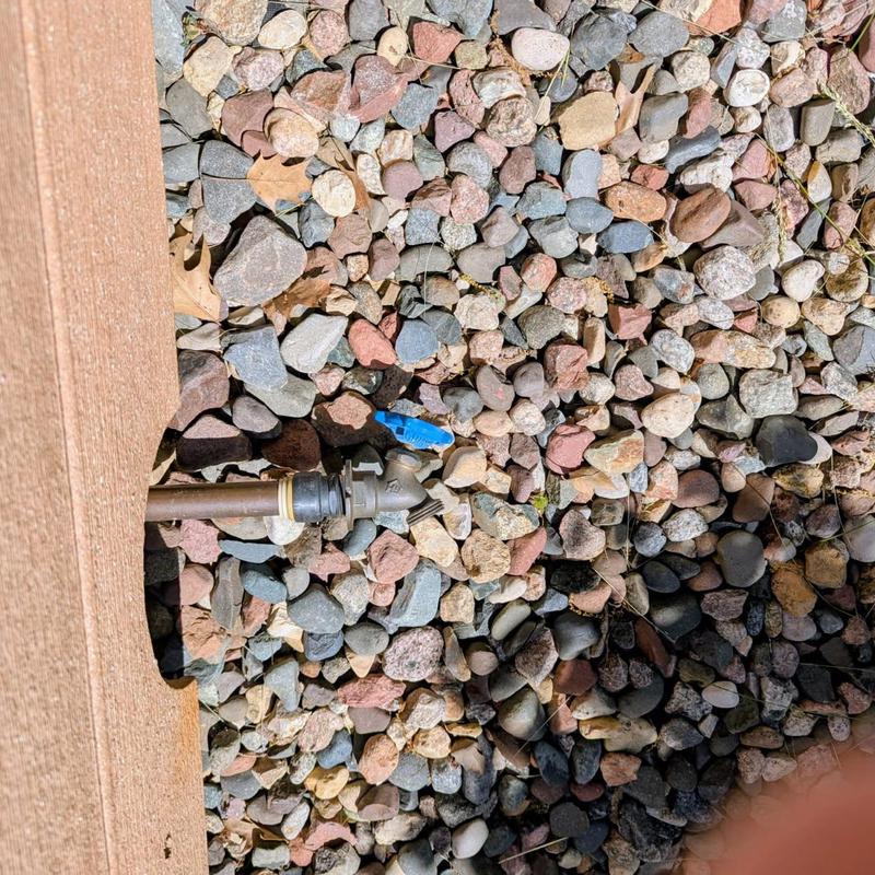 Outdoor spigot with press-fit adapter under deck
