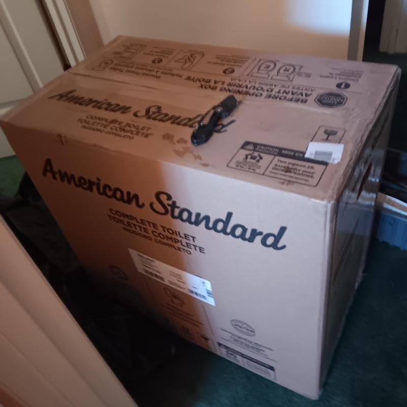 American Standard toilet unit in box for installation