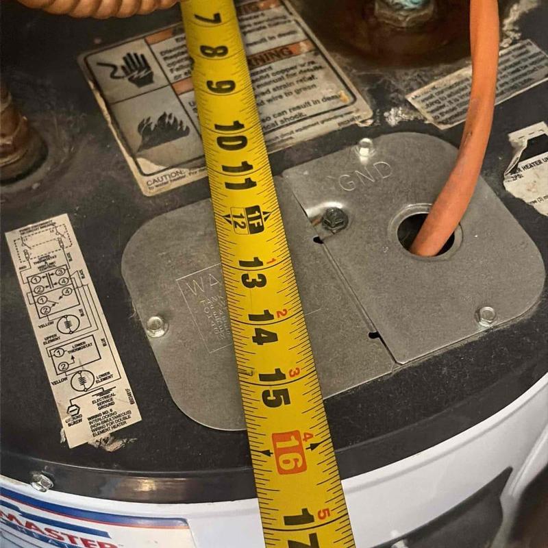 Water heater metal access panel with measuring tape Water heater metal access panel with measuring tape