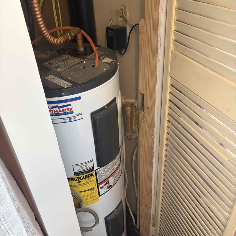 Water heater in tight closet behind bathtub Water heater in tight closet behind bathtub