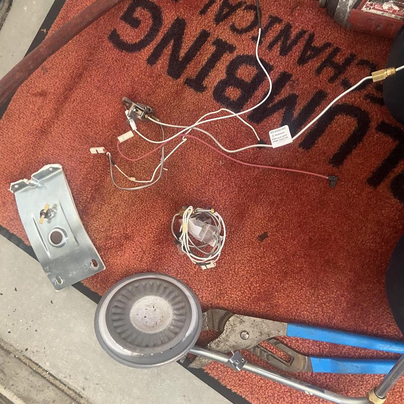 Water heater gas control valve and wiring on mat