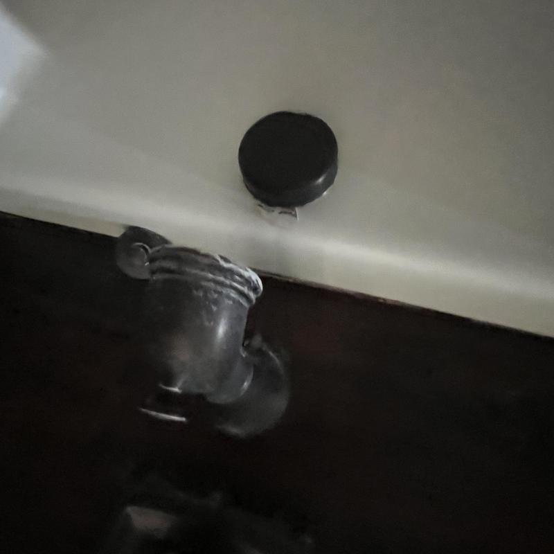 Bathtub drain piping with old plumbing and corrosion buildup Bathtub drain piping with old plumbing and corrosion buildup