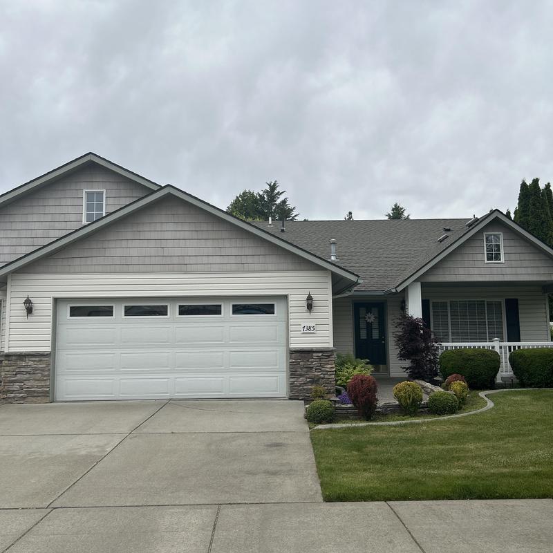Asphalt shingle roof on suburban home in Hayden, ID Asphalt shingle roof on suburban home in Hayden, ID
