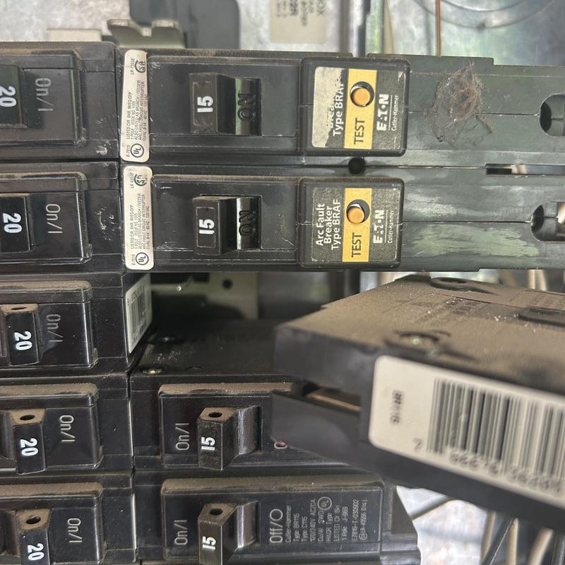 Arc fault breakers in residential electrical panel close-up Arc fault breakers in residential electrical panel close-up