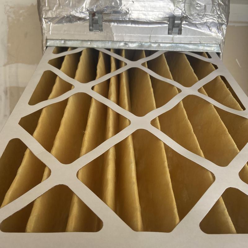 HVAC air filter installed in metal housing