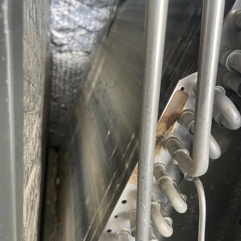 HVAC condenser coil and refrigerant lines close-up