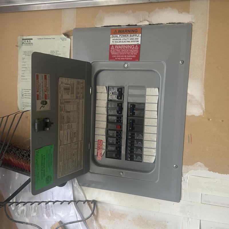 Electrical breaker panel with open door and labels Electrical breaker panel with open door and labels