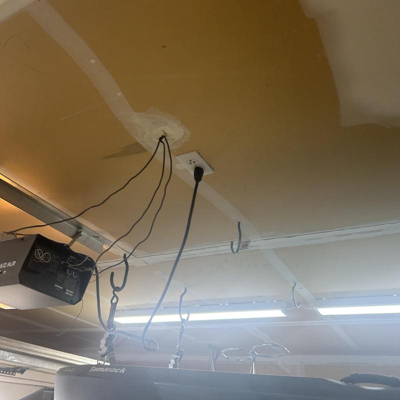 Garage ceiling electrical outlet with hanging wires Garage ceiling electrical outlet with hanging wires