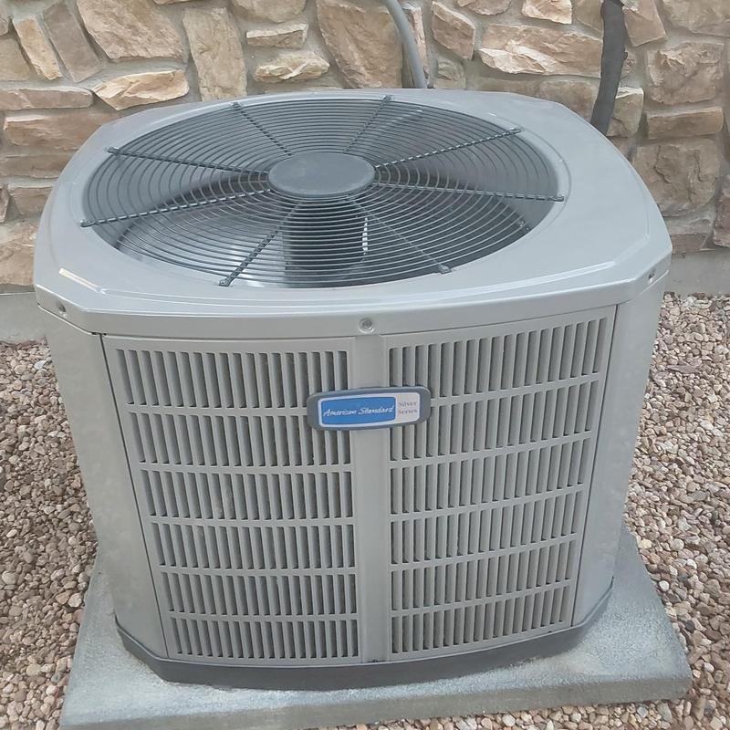 American Standard air conditioner condenser unit outdoors