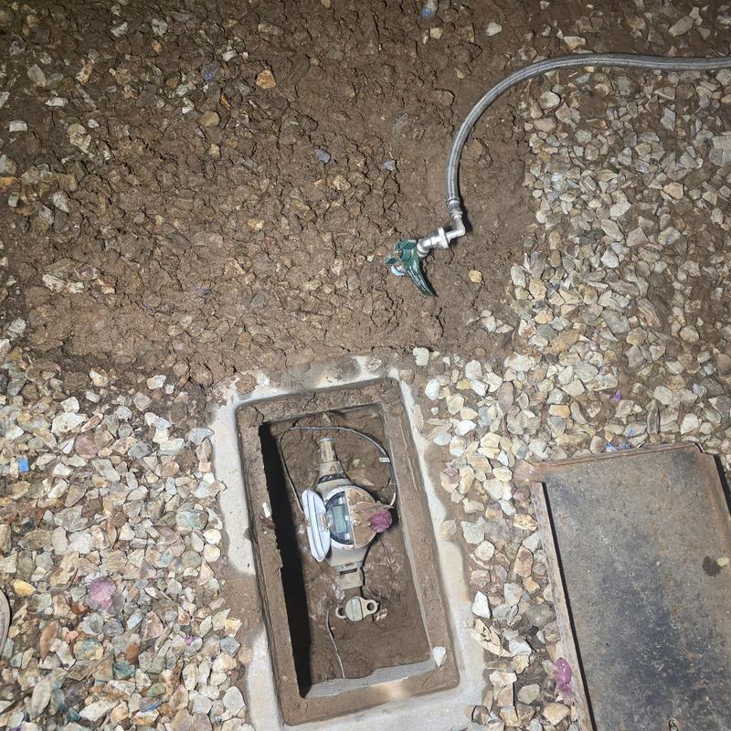 Water meter box with temporary bypass line installation Water meter box with temporary bypass line installation