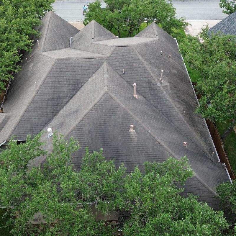 Asphalt shingle roof with visible granule loss Asphalt shingle roof with visible granule loss