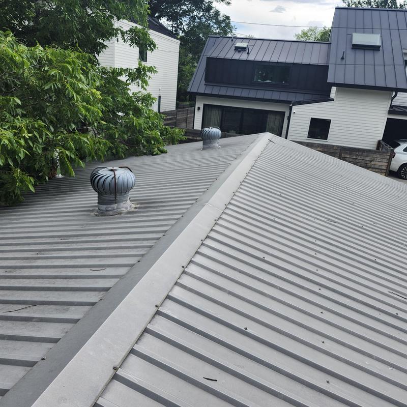 R-panel metal roof with two whirlybird vents R-panel metal roof with two whirlybird vents
