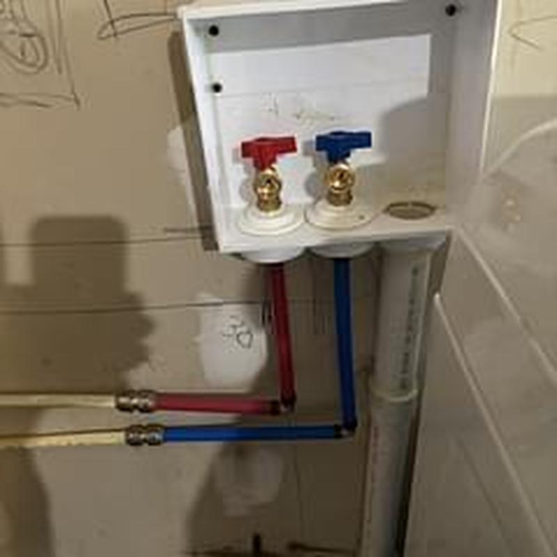 Washer box with red and blue supply valves installed Washer box with red and blue supply valves installed