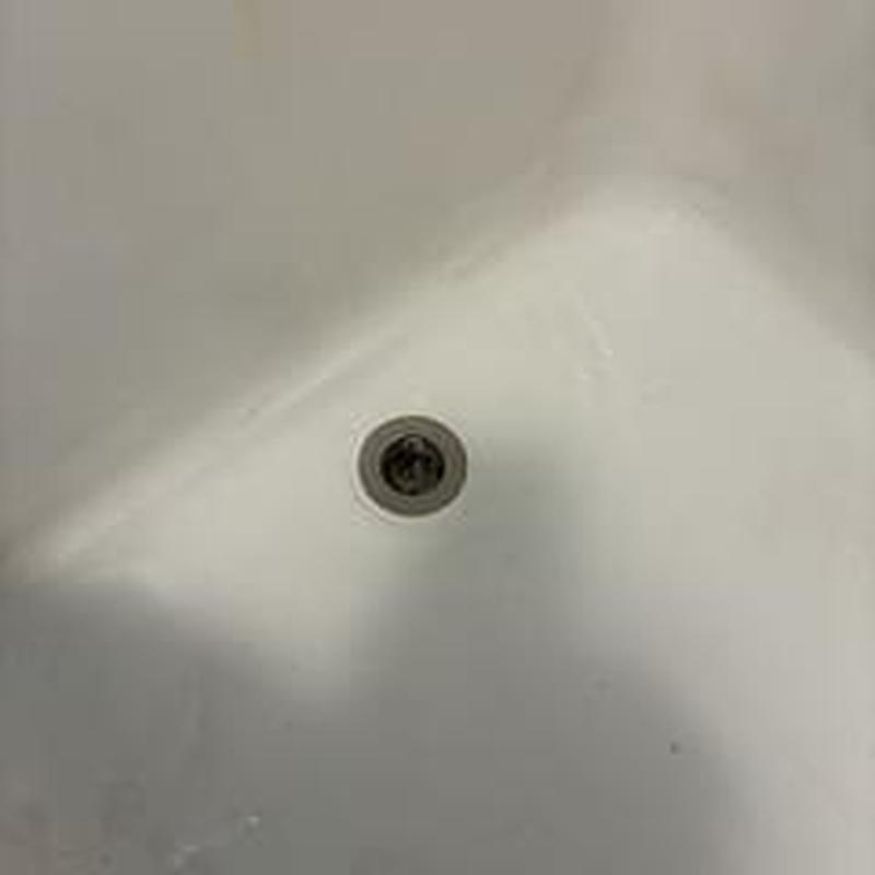 Bathtub drain with minor cleaning in progress Bathtub drain with minor cleaning in progress